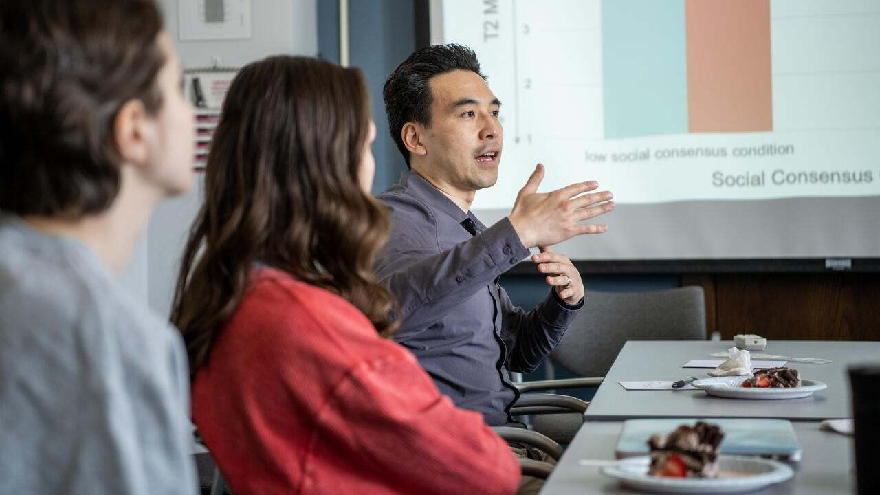 Professor Ken Fujita during a lab meeting with students