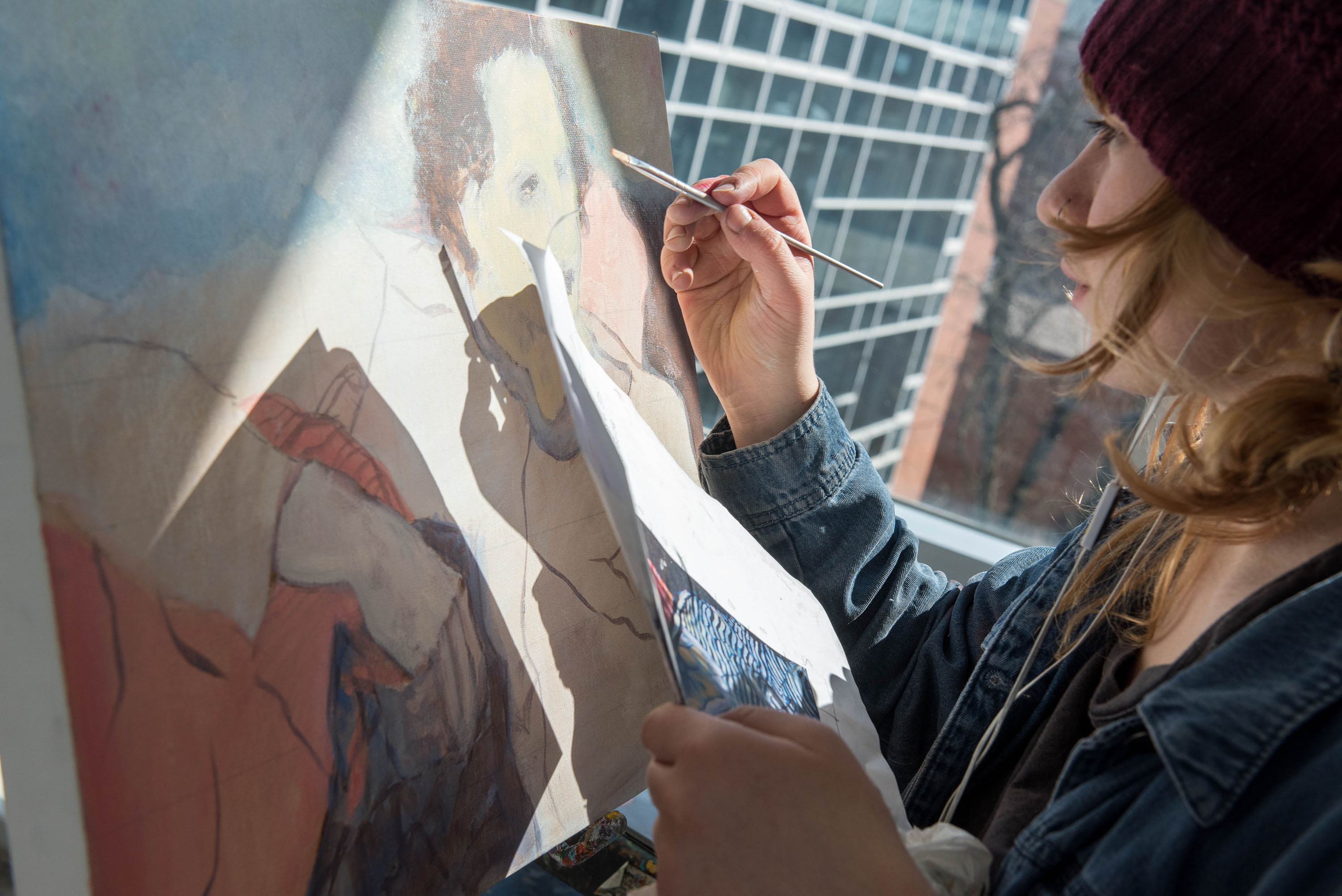 Student creating pencil drawing