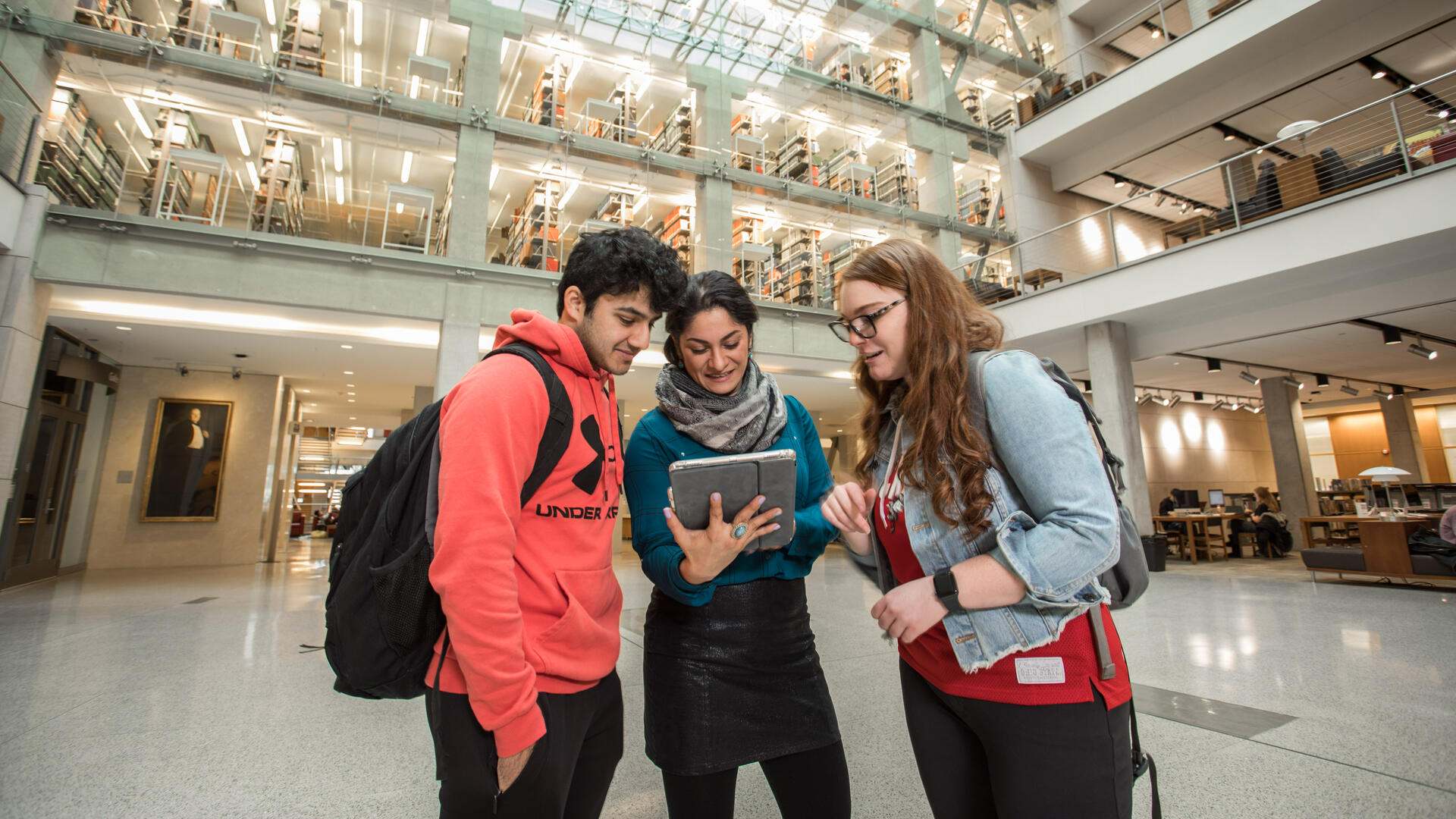 Students and Librarian in Thompson Library east atrium